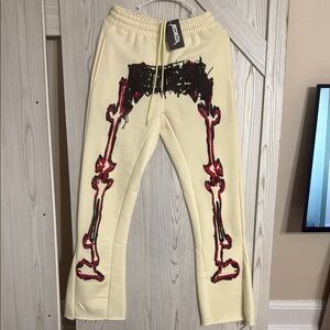 Cream and Red Sweatpants with Red Skeleton Design